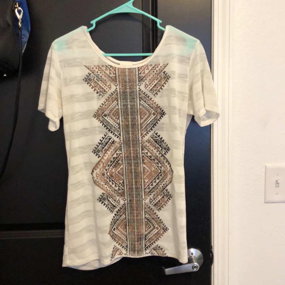 White top with brown detail and open back